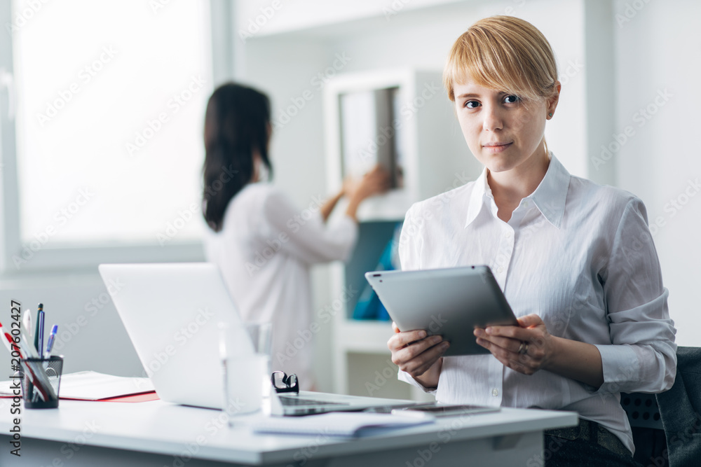Young woman in office