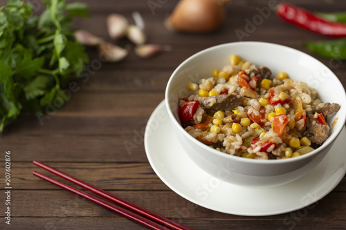 Delicious homemade wok fried rice with meat and vegetables
