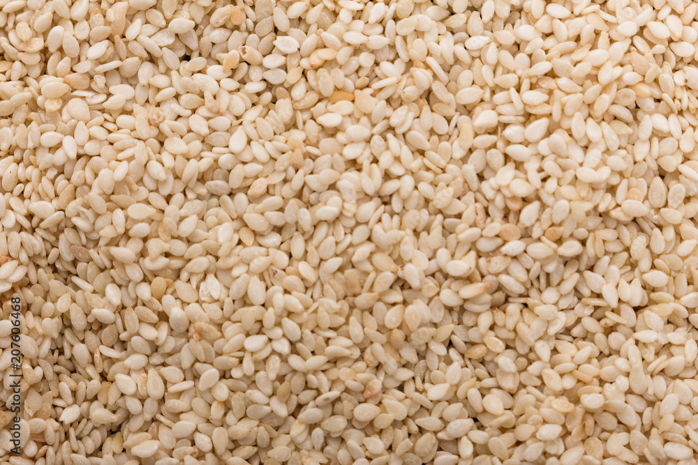 fresh sesame seeds on a rustic background fresh sesame seeds on a rustic background