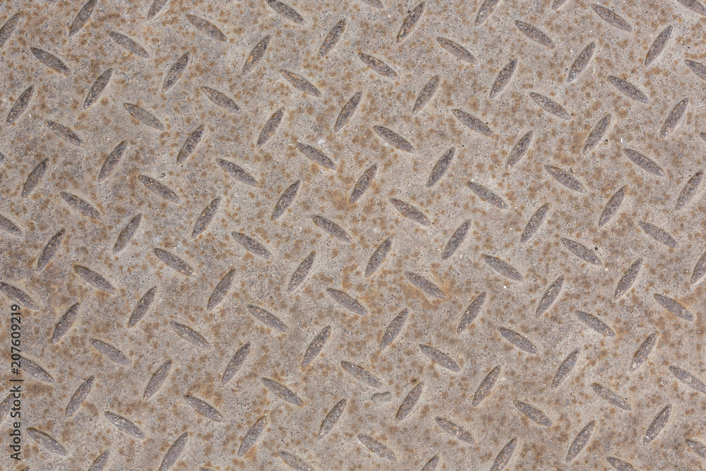 Industrial wallpaper of functional anti-slip metal diamond plate and rough raised surface pattern. Creative background macro photography of construction for catwalks, stairs, walkway. Industrial wallpaper of functional anti-slip metal diamond plate and rough raised surface pattern. Creative background macro photography of construction for catwalks, stairs, walkway.