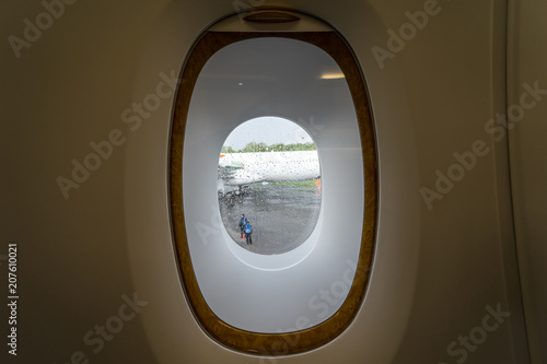 Fototapeta Naklejka Na Ścianę i Meble -  The window in the cabin of passenger aircraft.