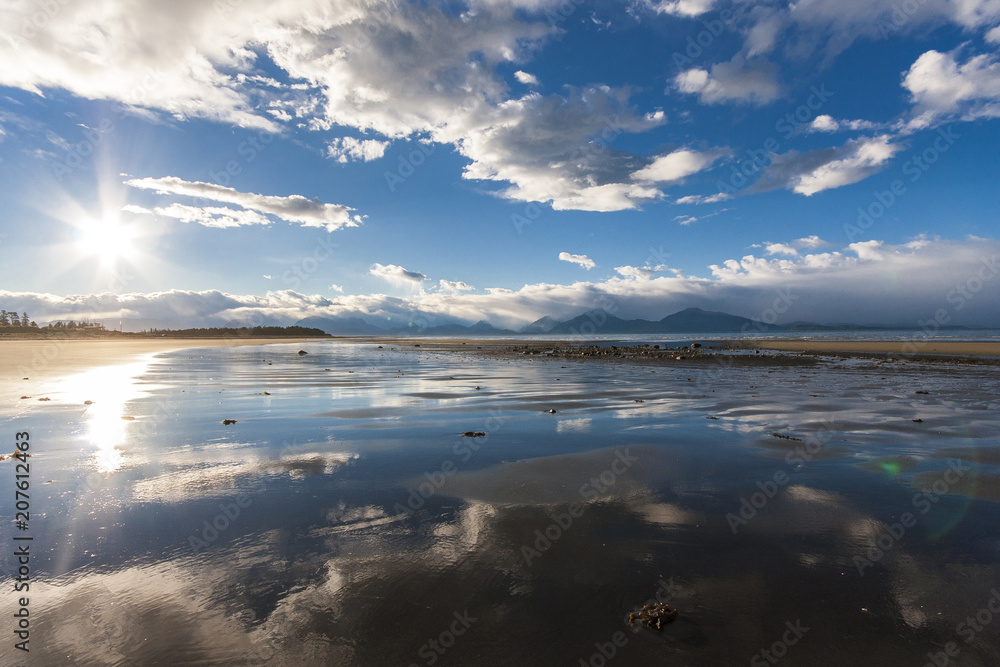 Reflection of sky in sandy beach of Alaska. Near Homer.