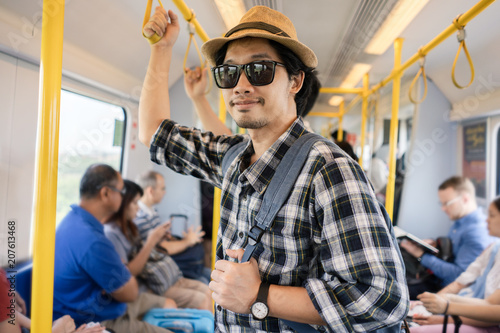 Asian man bag pack tourist in a train.