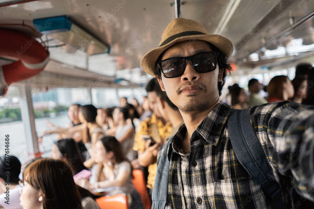Asian man bag pack tourist take a selfie in travelling at Thailand . Asian man bag pack tourist take a selfie in travelling at Thailand .
