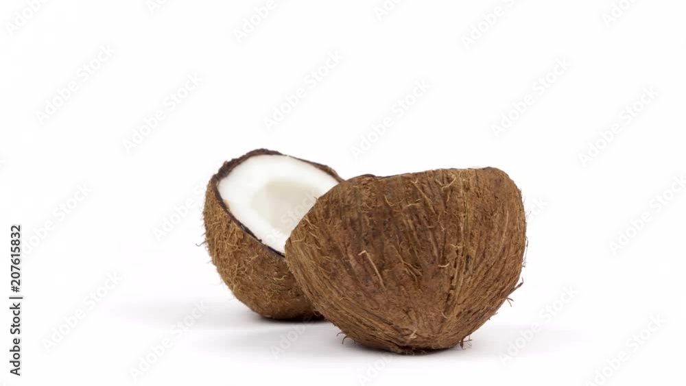 Two ripe tropical coconut halves with yummy white pulp rotating on white isolated background. Healthy fresh tropical fruits. Loopable seamless cocos rotating Two ripe tropical coconut halves with yummy white pulp rotating on white isolated background. Healthy fresh tropical fruits. Loopable seamless cocos rotating