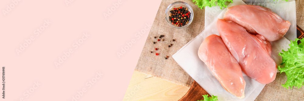 raw chicken fillets on wooden cutting board. raw chicken fillets on wooden cutting board.
