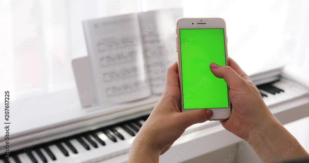 Close up hand woman young holding using smart phone with vertical green ...