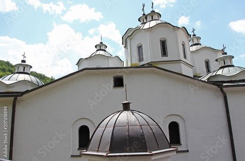 Church of Virgin Mary in a bright sunny day in east orthodox Monastery of St. Joachim of Osogovo, Kriva Palanka, Republic of Macedonia. The domes of a church. Christianity. Osogovo Monastery, Macedoni photo