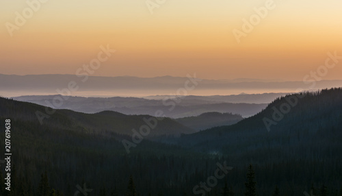 Morning fog over the valley at sunrise.