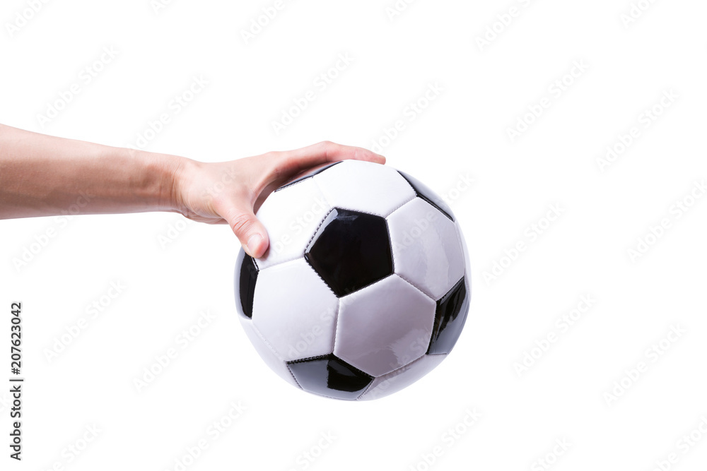 Obraz premium Hand holding soccer ball isolated on white background.