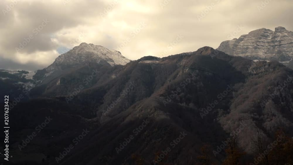 Timelapse - Clouds Float Above The High Beautiful Mountains And Hills Covered With Forest In The Cold Autumn Time Timelapse - Clouds Float Above The High Beautiful Mountains And Hills Covered With Forest In The Cold Autumn Time