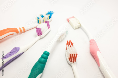 toothbrush with toothpaste on white background