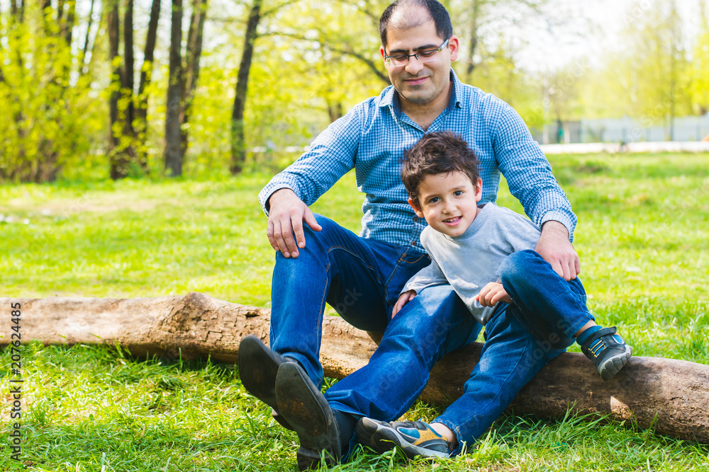 Fototapeta premium father and son relax in nature
