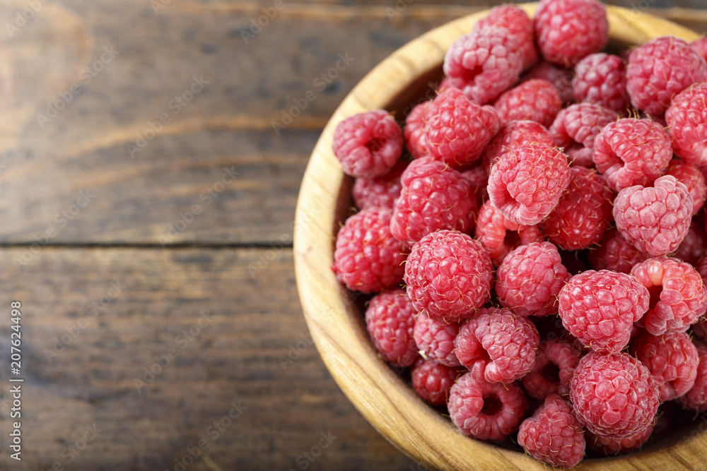 ripe raspberries on a plate, close up. ripe raspberries on a plate, close up.