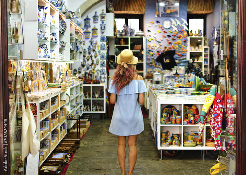 Blonde woman in souvenir shop in Lisbon, Portugal photo
