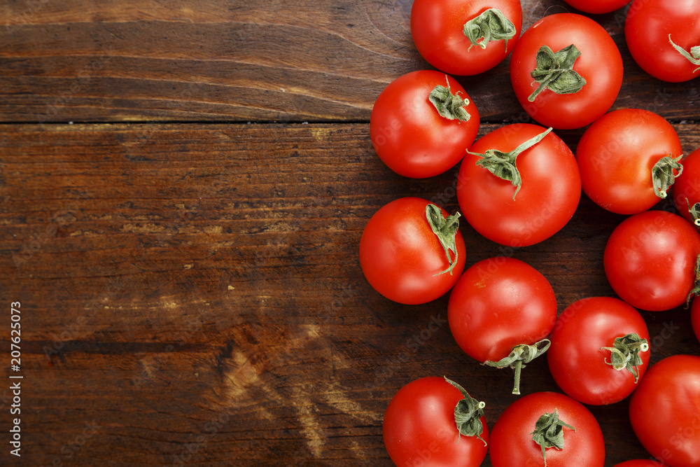ripe tomatoes on a wooden background ripe tomatoes on a wooden background