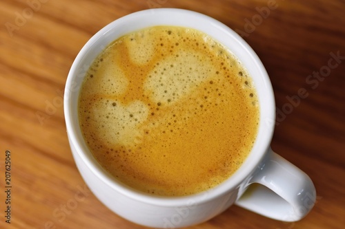 Fresh tasty espresso cup on background. Morning cup of coffee for a good start of the day