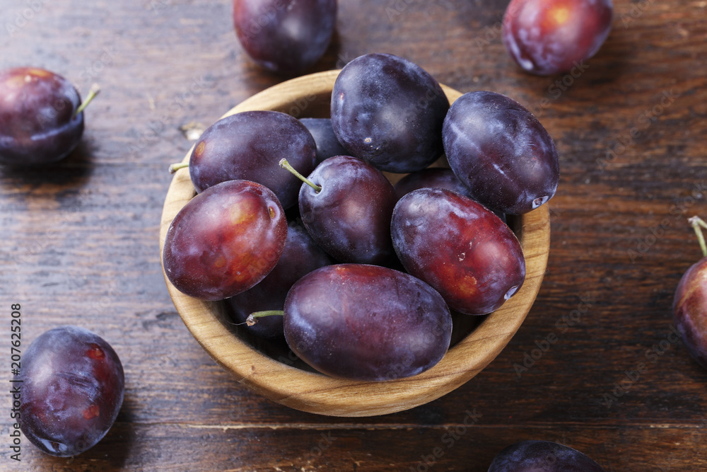 ripe plums in a plate