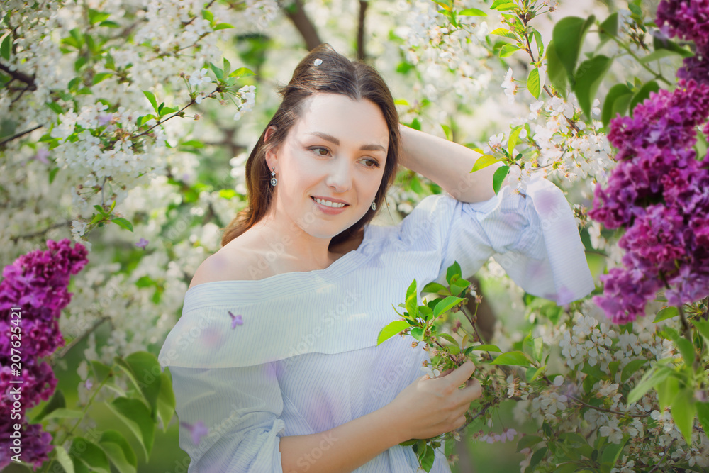 beautiful young brunette woman standing near the apple tree beautiful young brunette woman standing near the apple tree