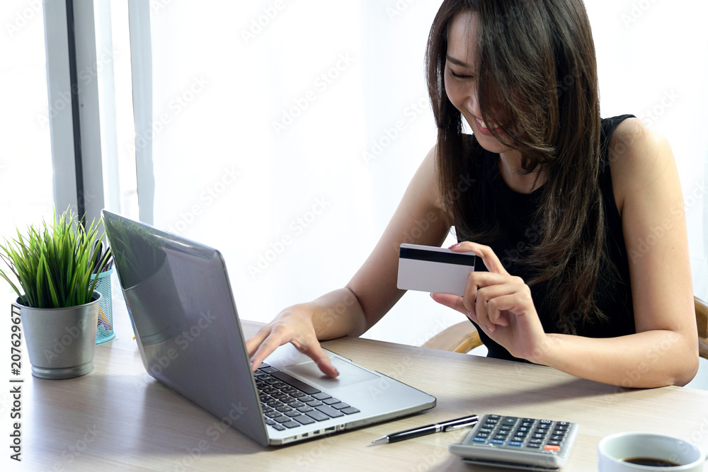 Business Woman use Credit Card to Shopping Online with Computer Laptop Business Woman use Credit Card to Shopping Online with Computer Laptop
