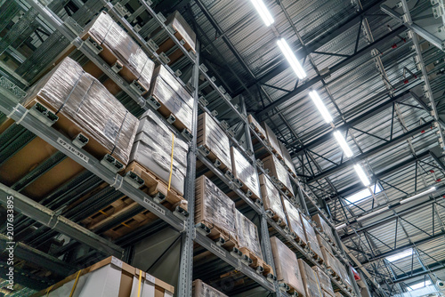 Industrial warehouses and shelves with boxes © Vink Fan