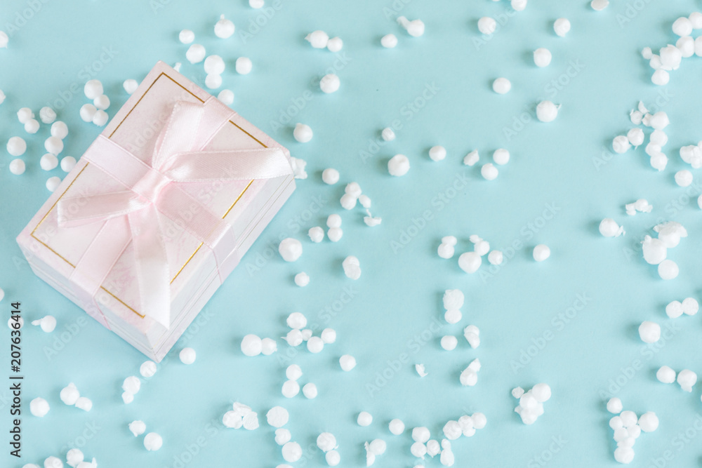 Gift box wrapped with ribbon on pastel creative clor background.Copy space.Mockup for design. Gift box wrapped with ribbon on pastel creative clor background.Copy space.Mockup for design.