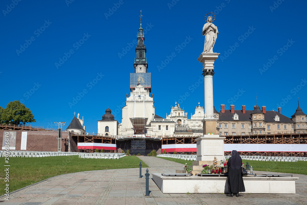Nun prays over the monument