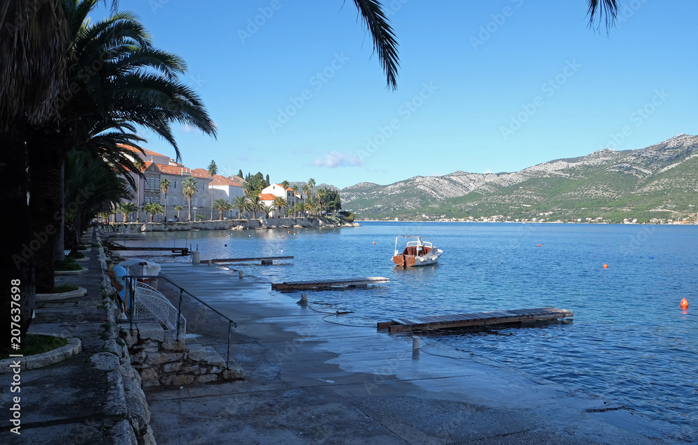 Obraz premium Seafront view at picturesque medieval Dalmatian town Korcula, Croatian culture and historic destination.