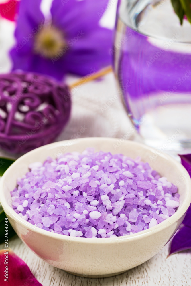 Purple Lilac and Clematis Salt for Spa and Aromatherapy. Selective focus. Purple Lilac and Clematis Salt for Spa and Aromatherapy. Selective focus.
