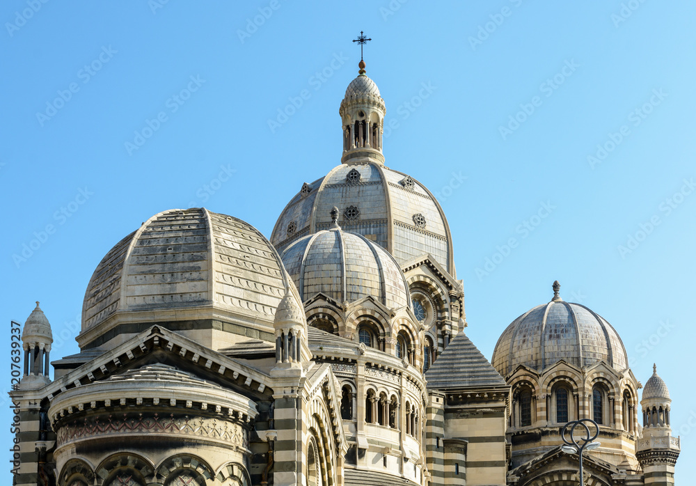 Close-up view of the cathedral of Marseille, Sainte-Marie-Majeure, also known as La Major, a neo-byzantine style catholic building achieved in 1893, showing several cupolas, chapels and turrets.