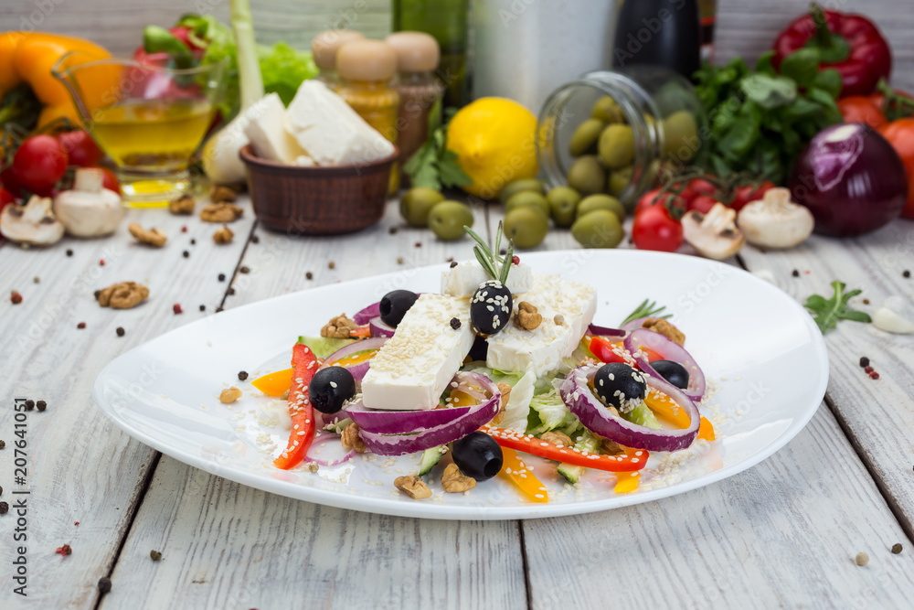Greek salad with fresh vegetables, feta cheese and black olives Greek salad with fresh vegetables, feta cheese and black olives
