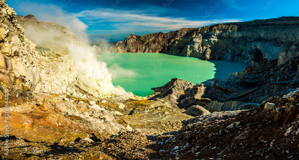 Panorama of smoking Kawah Ijen volcano crater with sulphur mine, Indonesia