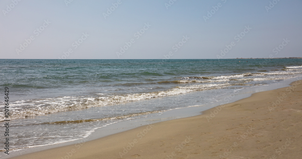 Sandy beach and sea water background.