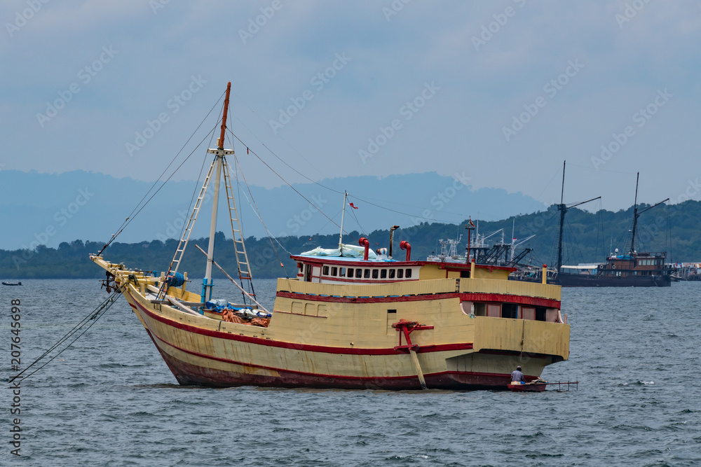 traditional wooden boat in port of Sorong, Raja Ampat, Indonesia