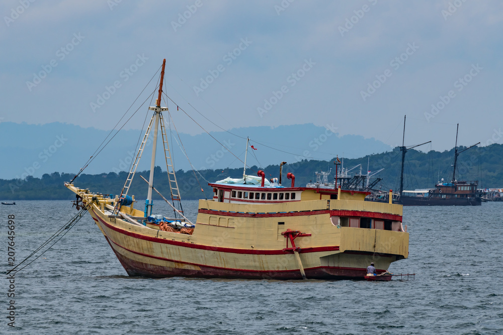 traditional wooden boat in port of Sorong, Raja Ampat, Indonesia traditional wooden boat in port of Sorong, Raja Ampat, Indonesia