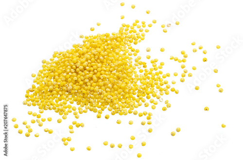 Heap of millet seeds isolated on white background photo