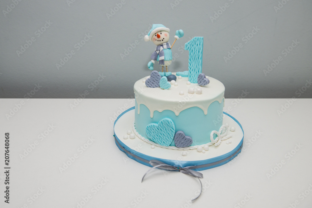 Colorful Decoration Of A First Year Birthday Cake. Baby Cake Smash. Birthday  Cake For 1 Year Old Boy. Winter Cake With A Snowman. Stock Photo | Adobe  Stock