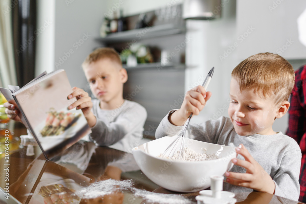 two little brothers help mom prepare delicious and healthy breakfast two little brothers help mom prepare delicious and healthy breakfast