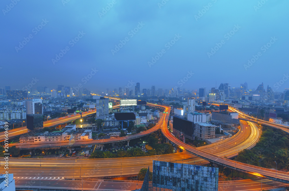 long exposure night cityscape with building and traffic on the road express way and light from building.