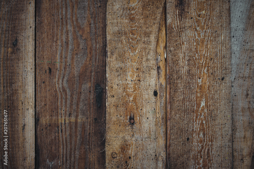 Vertical wooden planks forming a rough wood texture background