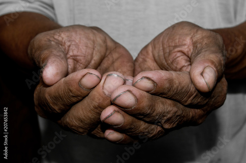 Hands poor poverty elder man begging you for help. Concept hunger people or poverty. Selective focus. Poverty in retirement.