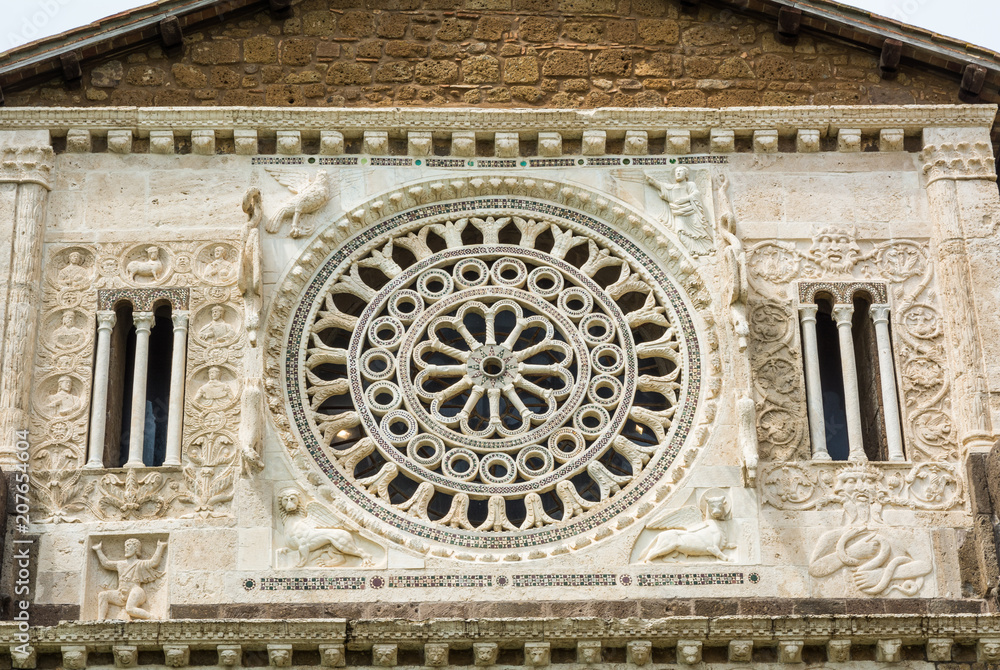Tuscania (Viterbo), Italy. S. Pietro Chuch. Rose window with the symbols of the Evangelists.