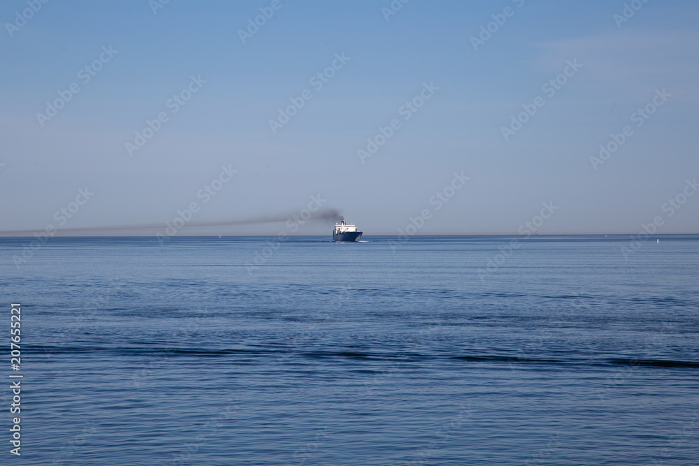 Beautiful ocean view with blue sky and transport ship Beautiful ocean view with blue sky and transport ship