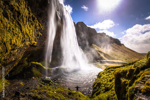 Seljalandsfoss - May 04  2018  Traveler at the Seljalandsfoss waterfall  Iceland