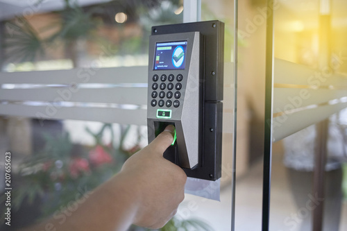 Quadro em tela Yong man or woman push finger down on the electronic control machine to access t