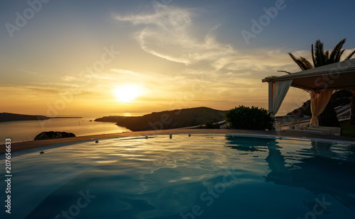 Infinity pool at dusk in Santorini, Cyclades Islands, Greece © dpVUE .images