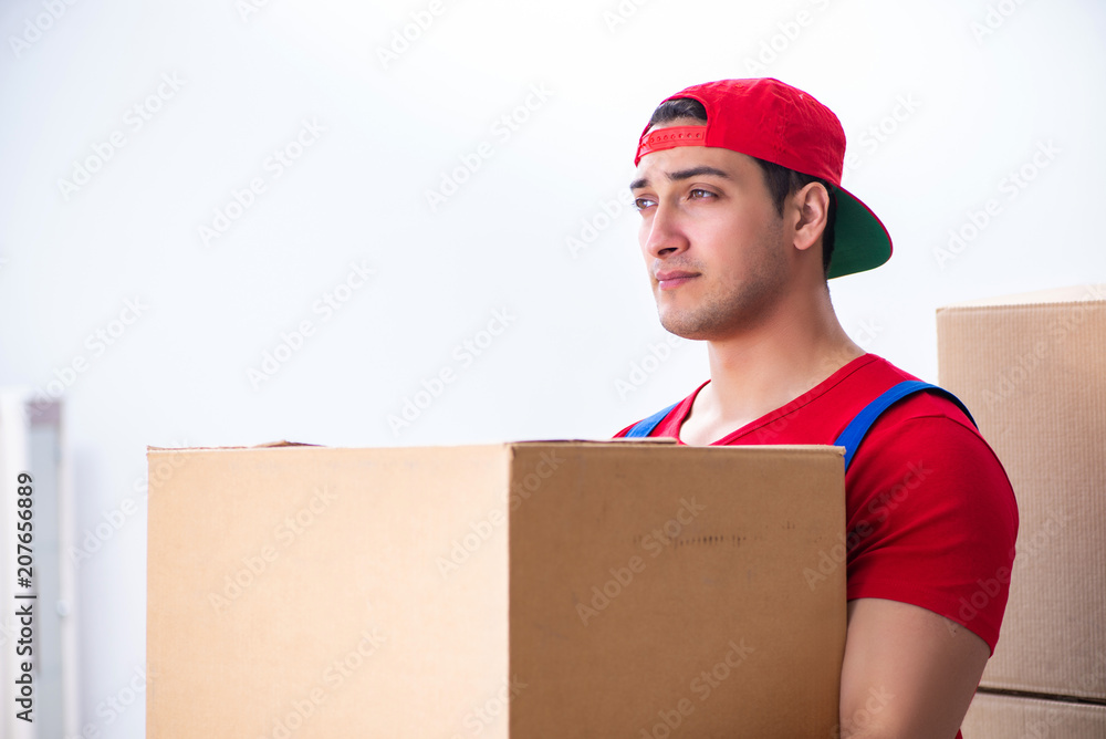 Contractor worker moving boxes during office move Contractor worker moving boxes during office move