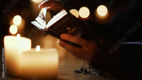 Man reading the Holy Bible and praying in the Church photo