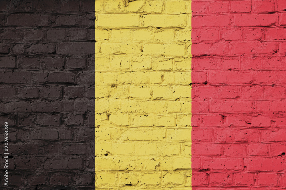 Texture of Belgium flag on a pink brick wall. Texture of Belgium flag on a pink brick wall.