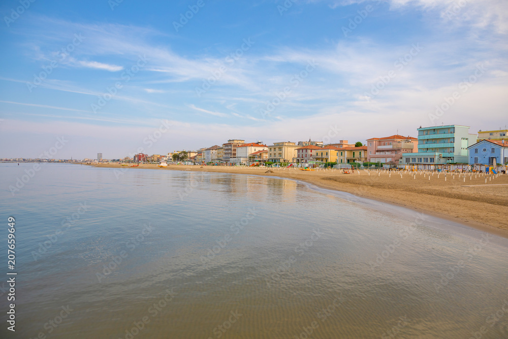 A beach in Adriatic sea in Rimini at sunset time in Italy